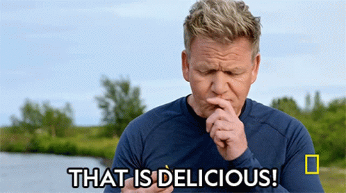 Man in Blue Shirt Saying That Is Delicious