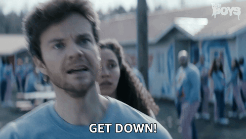 Man in Blue Shirt Says Get Down
