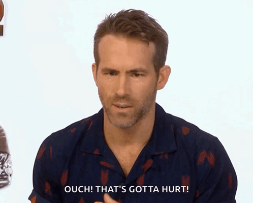 Man in Blue Shirt Says Ouch