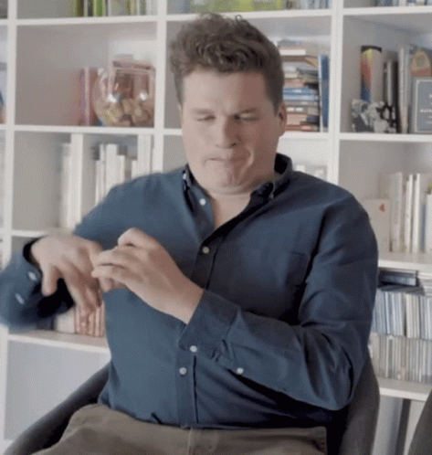 Man in Blue Shirt Sitting Eyes Closed