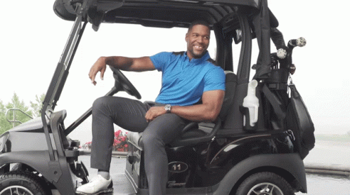 Man In Blue Shirt Sitting In Golf Cart Number 11 GIF