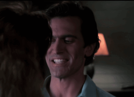 Man in Blue Shirt Smiling at Woman