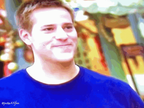 Man in Blue Shirt Smiling Justaallfan
