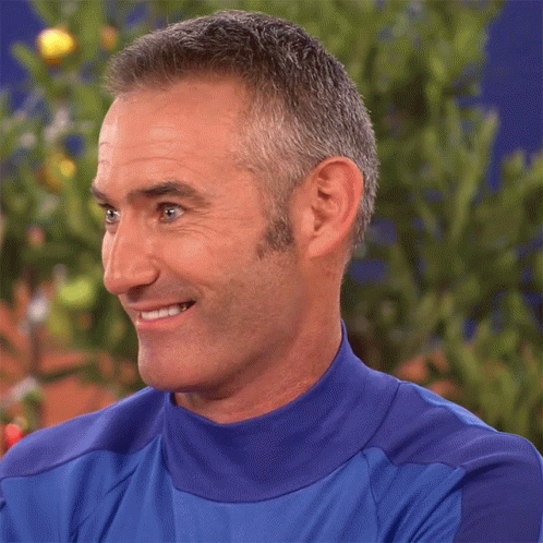 Man in Blue Shirt Smiling