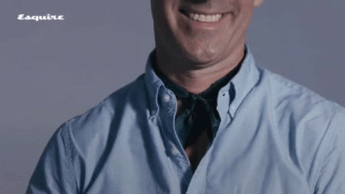 Man In Blue Shirt Smiling With Esquire Logo GIF