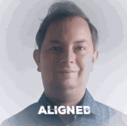Man in Blue Shirt Smiling Word Aligned