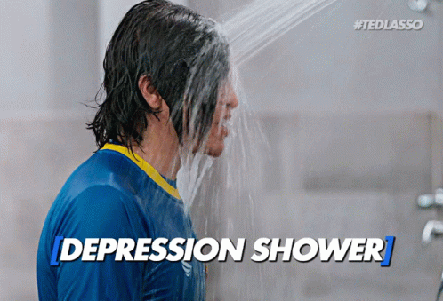 Man in Blue Shirt Taking Shower