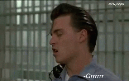 Man In Blue Shirt Talking On Phone GIF