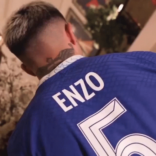 Man in Blue Shirt With Enzo on Back