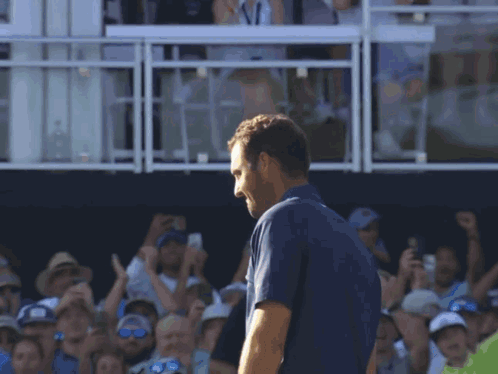 Man In Blue Shirt With Flea GIF
