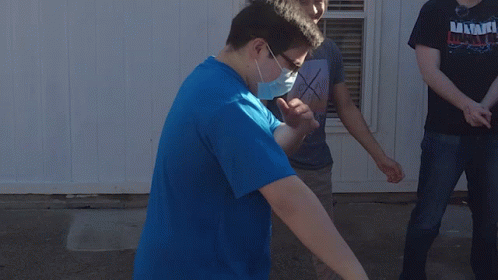 Man in Blue Shirt With Foundation Laying on Ground