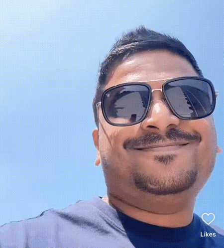 Man In Blue Shirt With Heart GIF