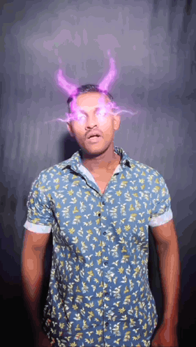 Man in Blue Shirt With Horns