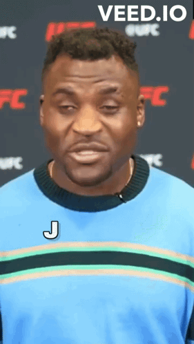 Man in Blue Shirt with J Letter