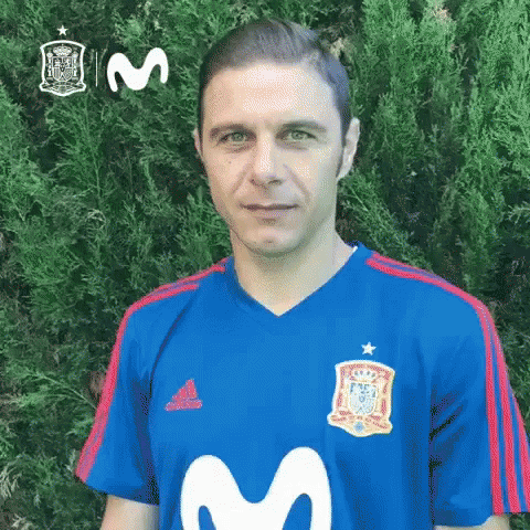 Man in Blue Shirt With Letter M