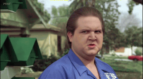 Man In Blue Shirt With Monster Logo GIF