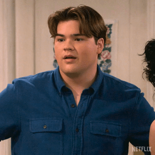 Man in Blue Shirt with Netflix Logo