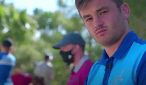 Man in Blue Shirt With Puma Logo