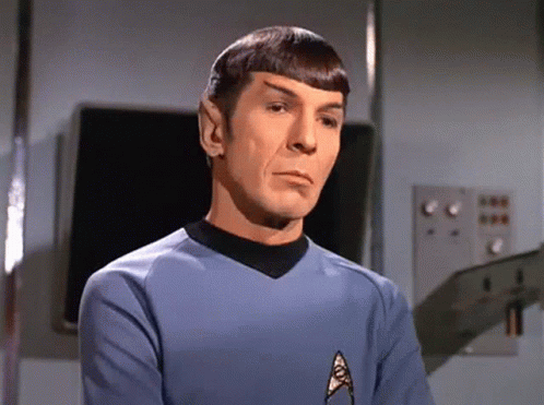 Man in Blue Shirt with Star Trek Logo