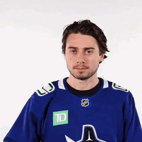 Man in Blue Shirt with TD Logo