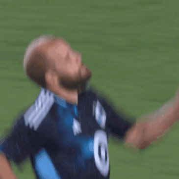 Man in Blue Shirt With White Target