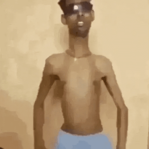 Man in Blue Shorts and Sunglasses