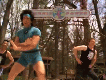 Man in Blue Shorts Dancing Near This Power Sign