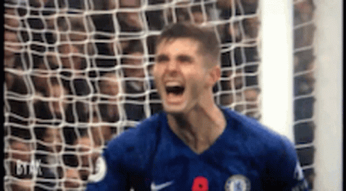 Man in Blue Soccer Jersey Screaming