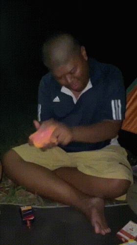 Man In Blue Striped Shirt Eating Food GIF