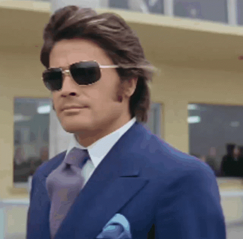 Man in Blue Suit and Sunglasses