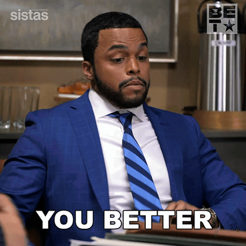 Man in Blue Suit and Tie Saying You Better