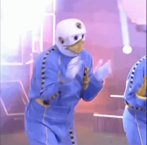Man In Blue Suit And White Helmet Dancing GIF