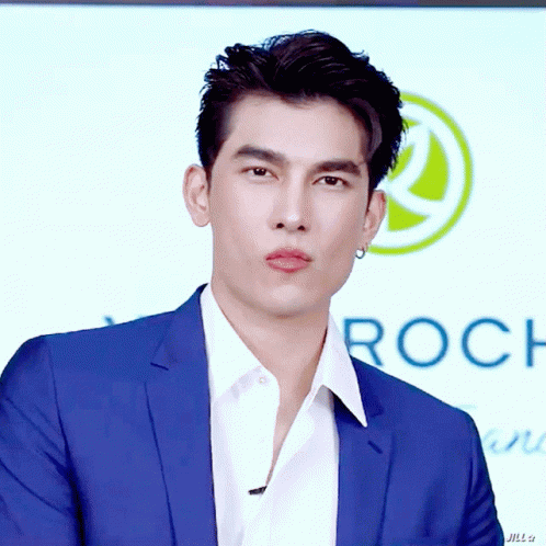 Man In Blue Suit And White Shirt With Roch Sign GIF