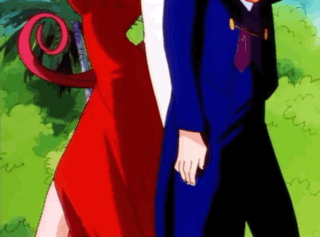 Man in Blue Suit and Woman in Red Dress