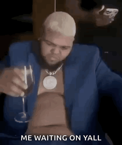 Man in Blue Suit Drinking Wine