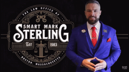 Man in Blue Suit in Front of Smart Mark Sterling Logo