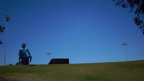 Man In Blue Suit Riding Motorcycle Dumb And Dumber GIF