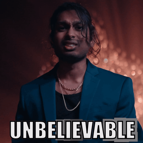 Man In Blue Suit Standing By Unbelievable Sign GIF
