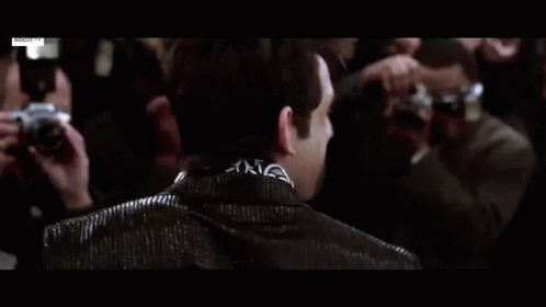Man In Blue Suit Standing In Crowd GIF