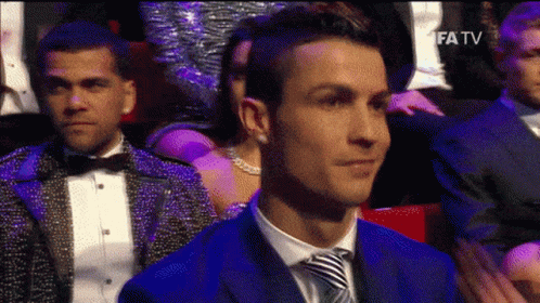 Man in Blue Suit Watching Fifatv TV