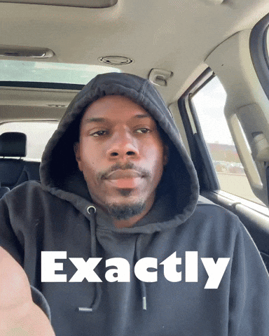 Man in Blue Sweater and Tie Saying Exactly