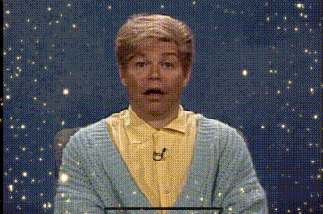 Man in Blue Sweater and Yellow Shirt Making Face
