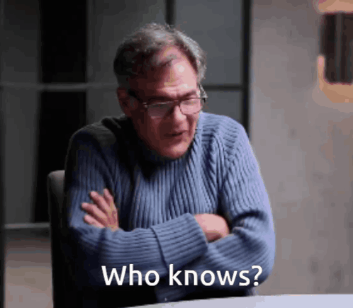 Man in Blue Sweater Asking Who Knows