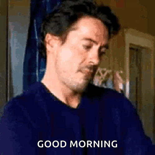 Man in Blue Sweater Saying Good Morning