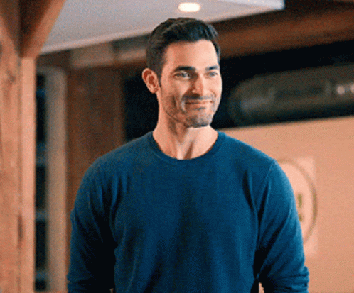 Man in Blue Sweater Smiling