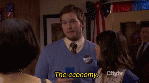 Man in Blue Sweater Talking About Economy