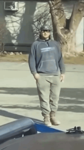 Man in Blue Sweatshirt and Hat