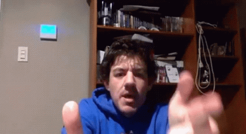 Man in Blue Sweatshirt Making Funny Face