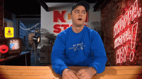 Man in Blue Sweatshirt Saying N St