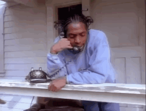 Man in Blue Sweatshirt Talking on Phone